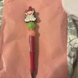 Beaded pen with refill ink pig